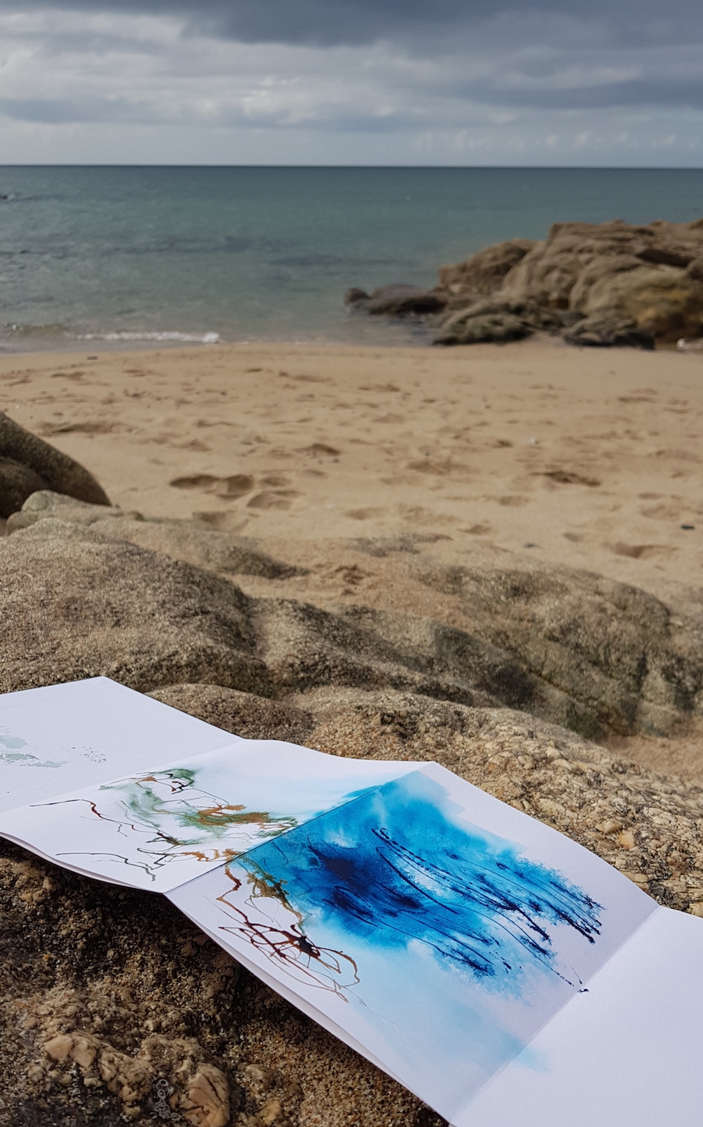 collaborative sketchbook on the beach